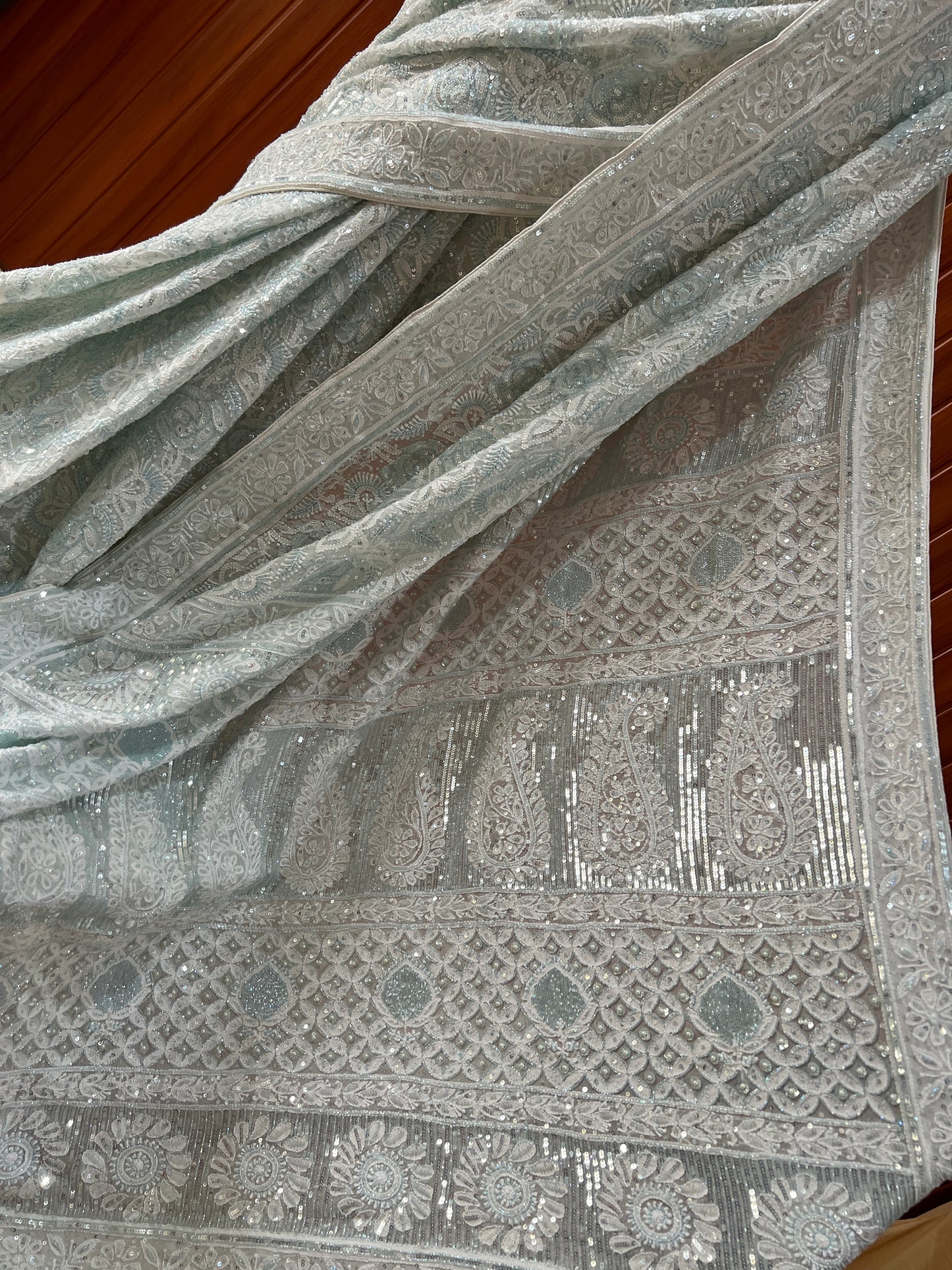 Ruhani light firozi embellished Chikankari hand Embroidered Saree