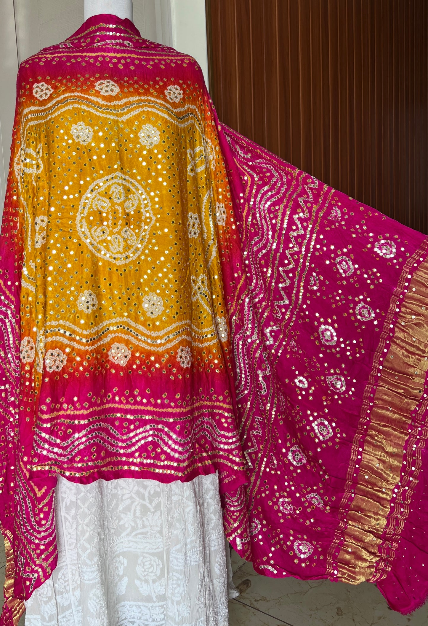 Pink and yellow Gajji Silk Bandhej dupatta with mukaish work
