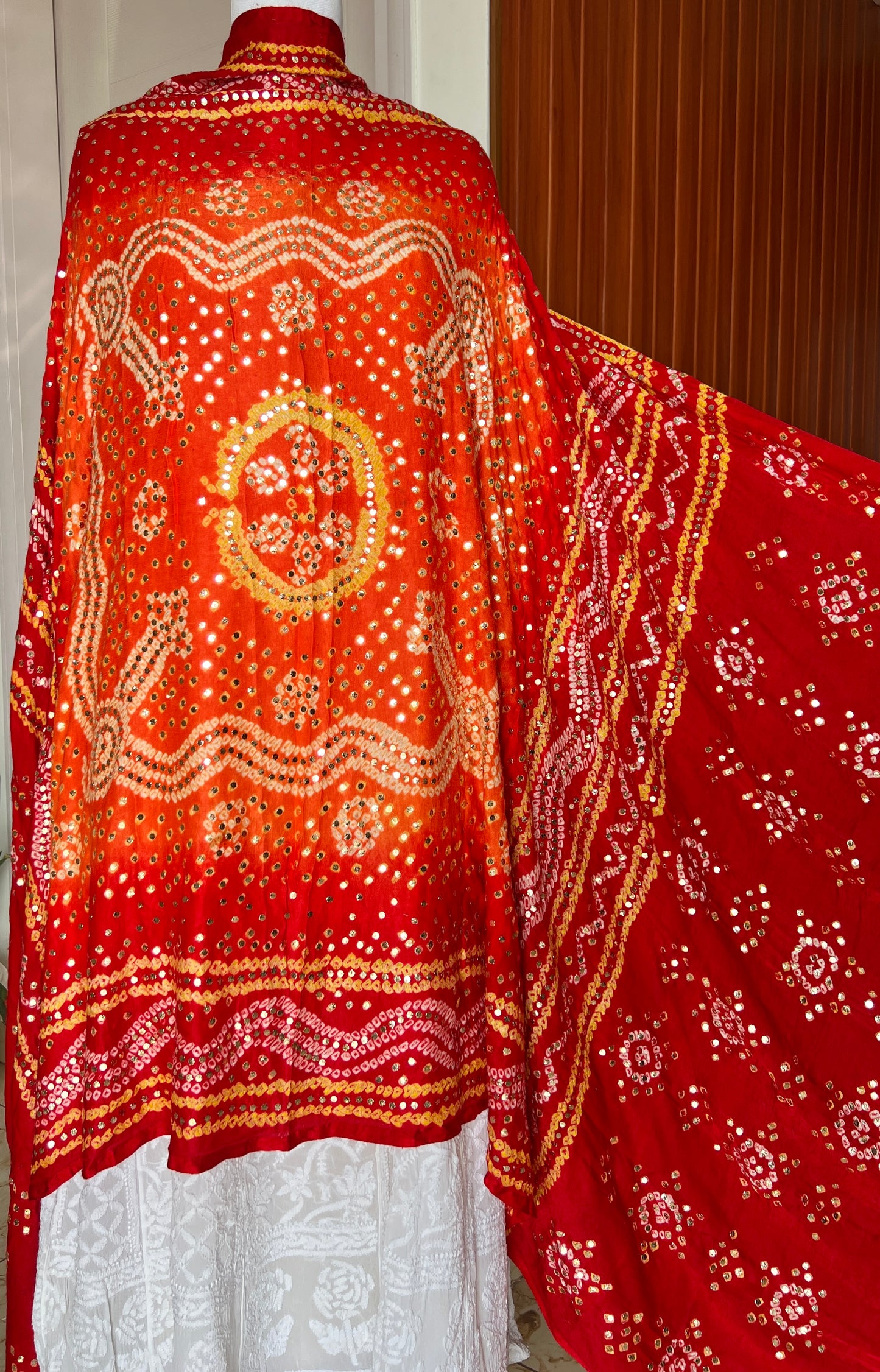 Orange and red Gajji Silk Bandhej dupatta with mukaish work