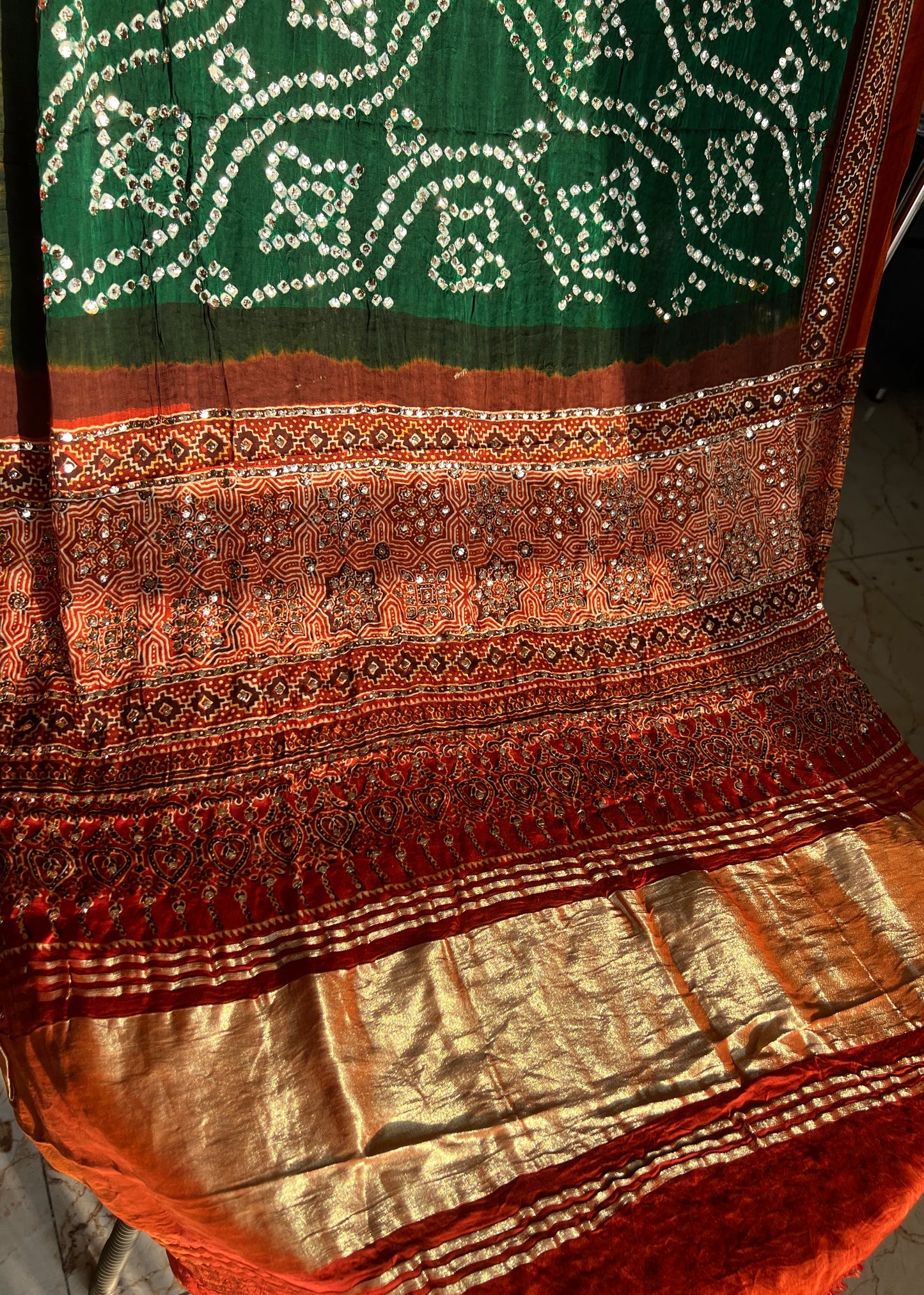 Rust and Green modal silk ajrakh and bandhej dupatta with heavy mukaish