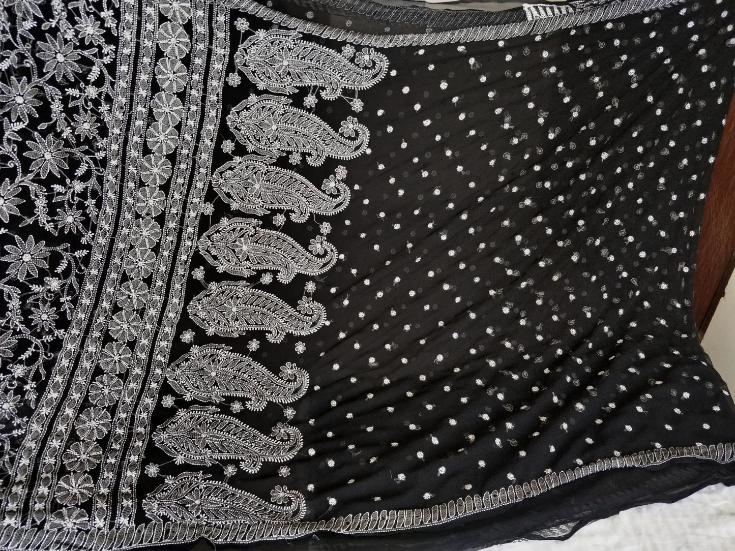 Black and white semi georgette resham chikankari saree.