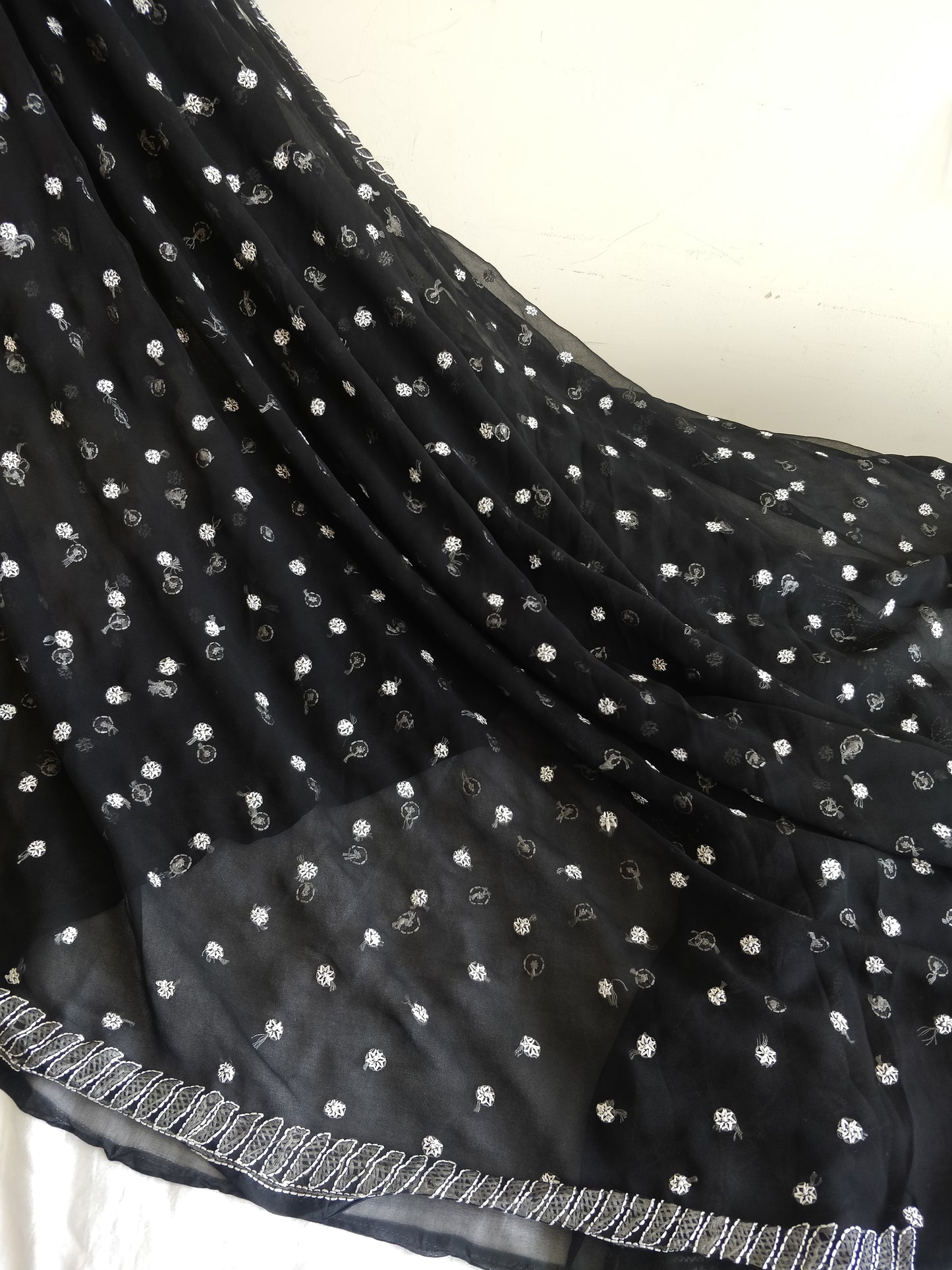 Black and white semi georgette resham chikankari saree.