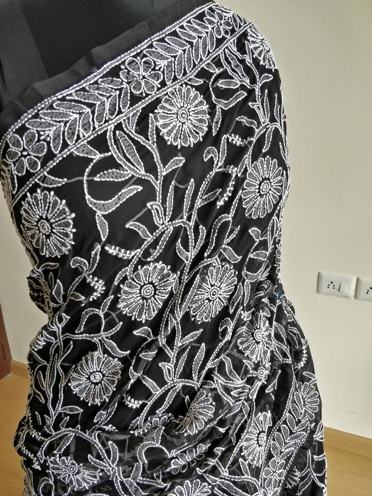Black and White semi georgette allover fine Chikankari saree.