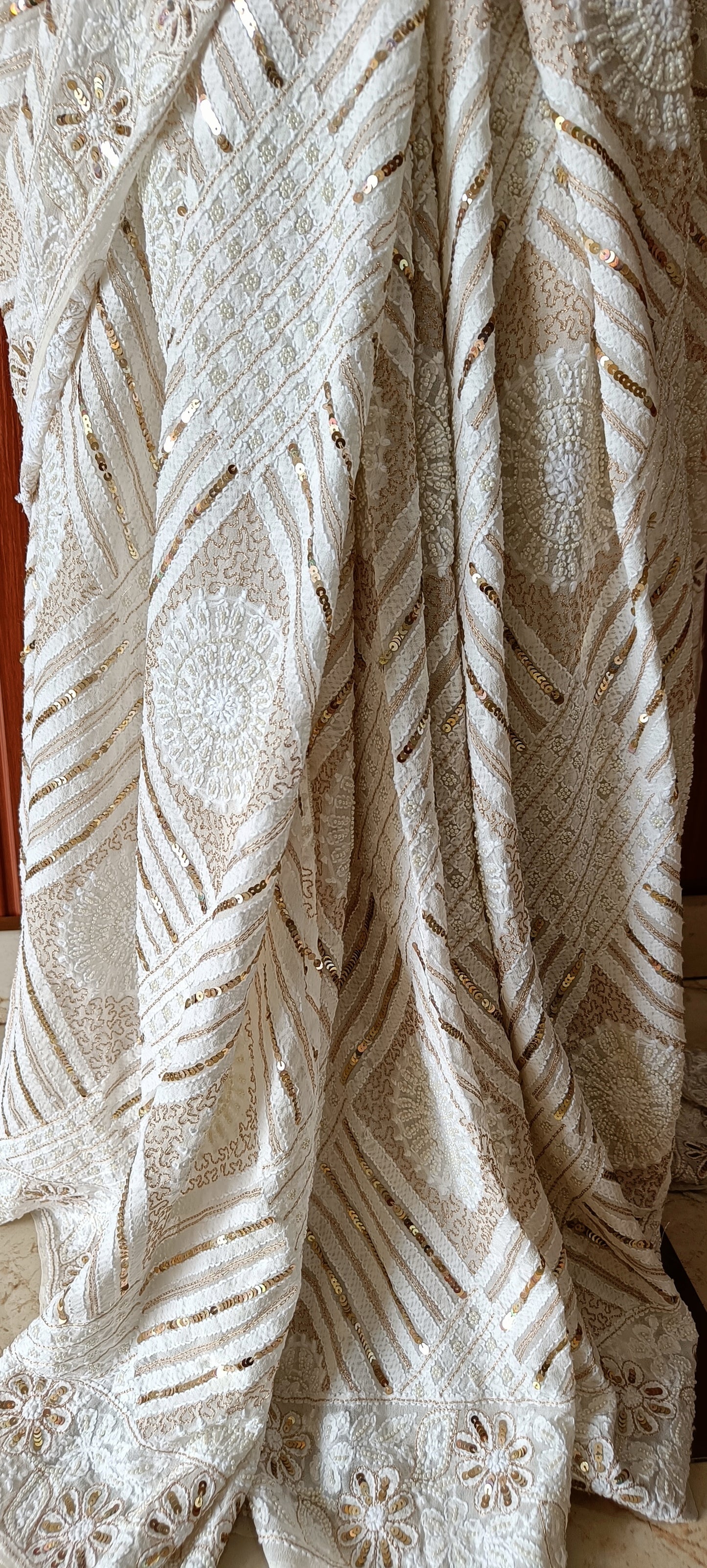 Ruhani Ivory Chikankari Saree with heavy Sequins Pearl and Aari Embroidery