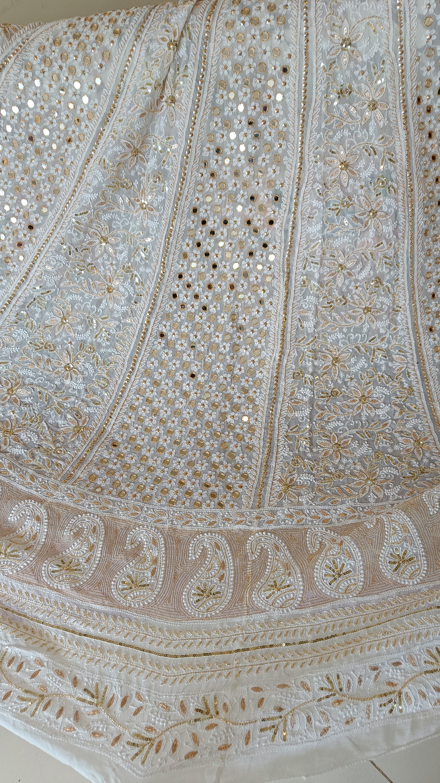 White designer lehenga skirt with allover Chikankari and heavy embellishments Lehenga skirt