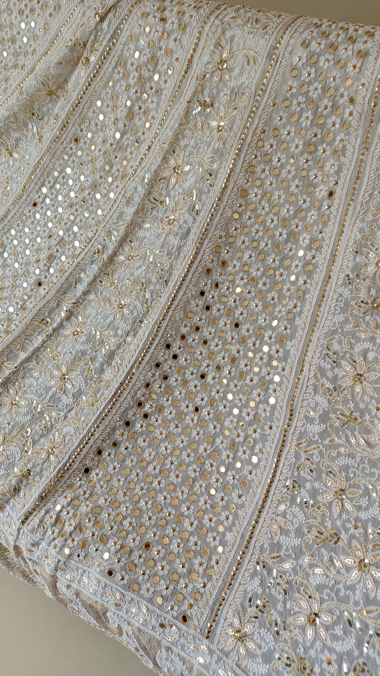 White designer lehenga skirt with allover Chikankari and heavy embellishments Lehenga skirt