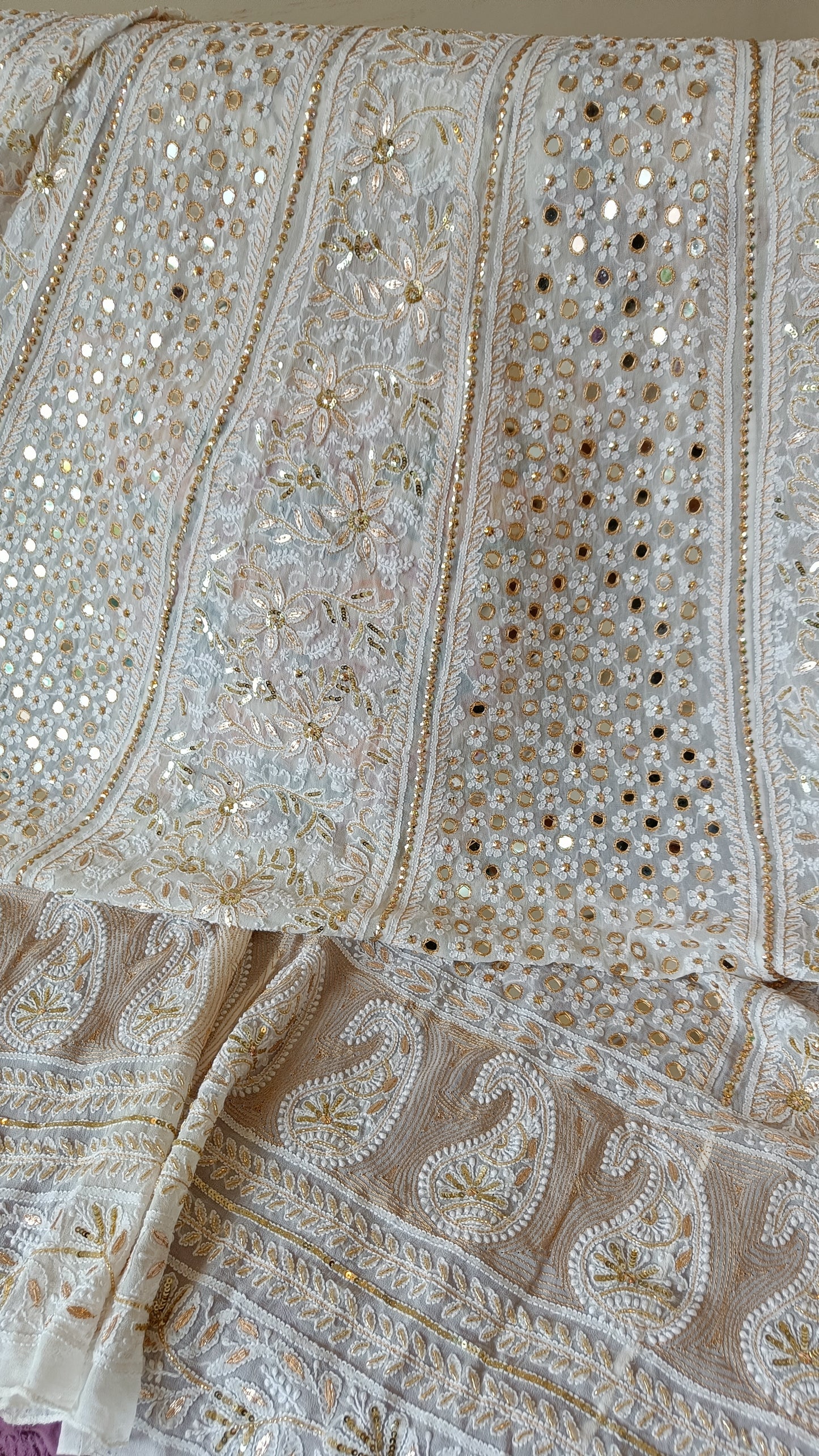 White designer lehenga skirt with allover Chikankari and heavy embellishments Lehenga skirt