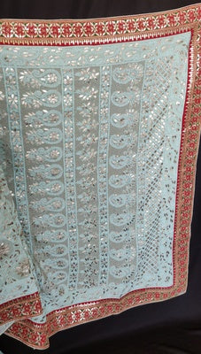 Ruhani sage green allover Chikankari and gota patti saree with red marori and gota border