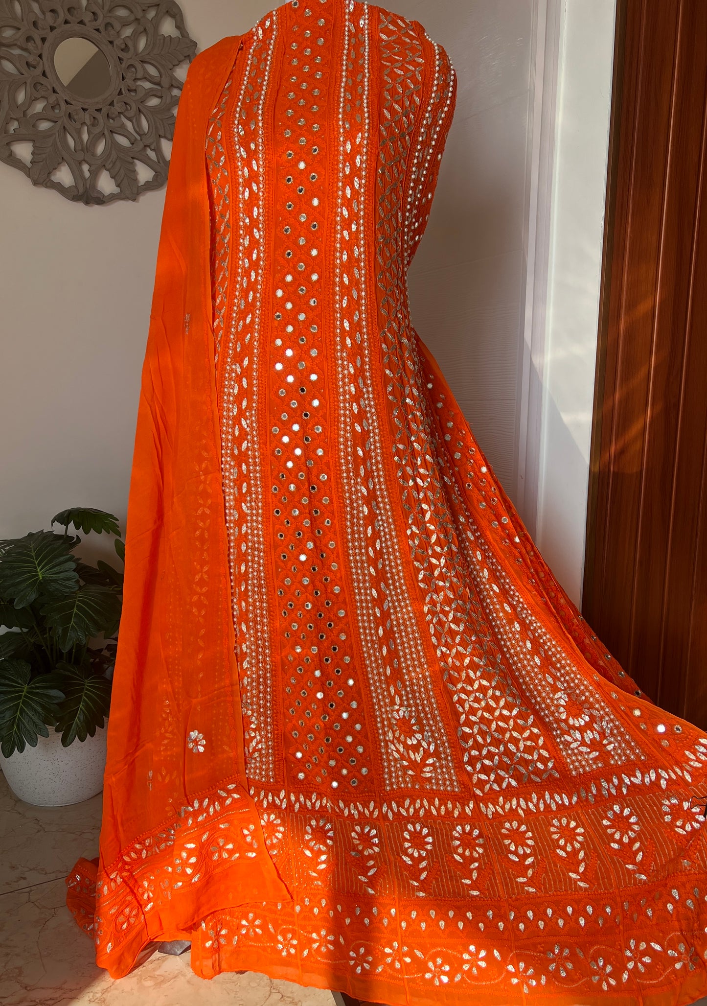 Orange Chikankari pearl mirror and Gota Anarkali