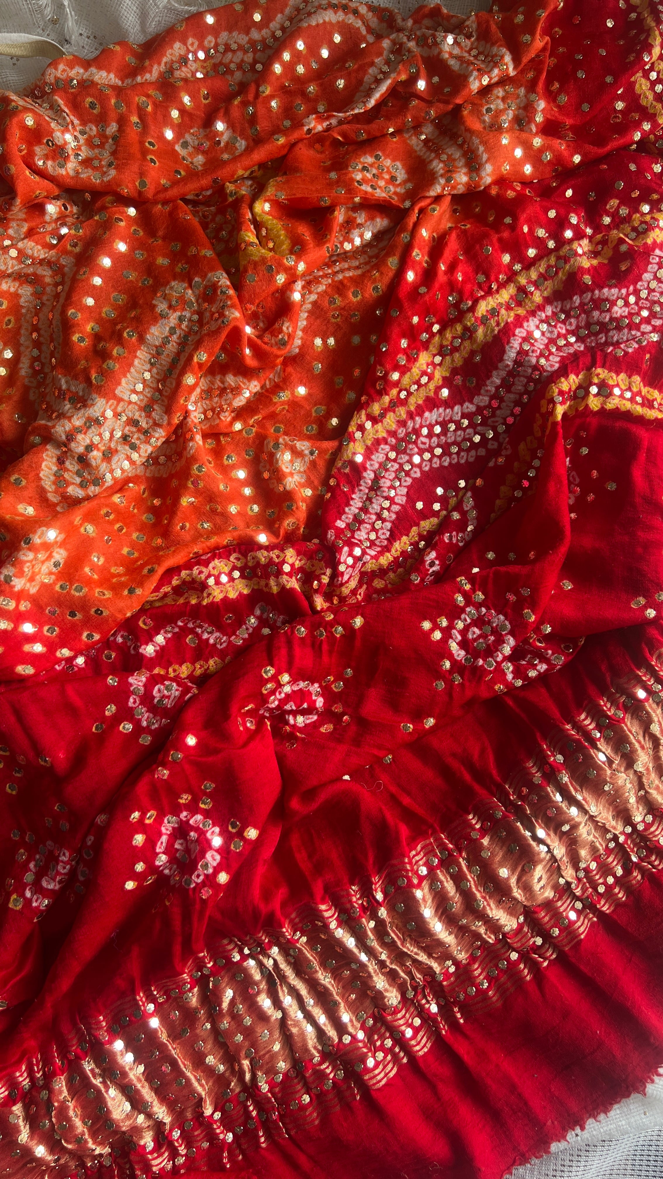 Orange and red Gajji Silk Bandhej dupatta with mukaish work