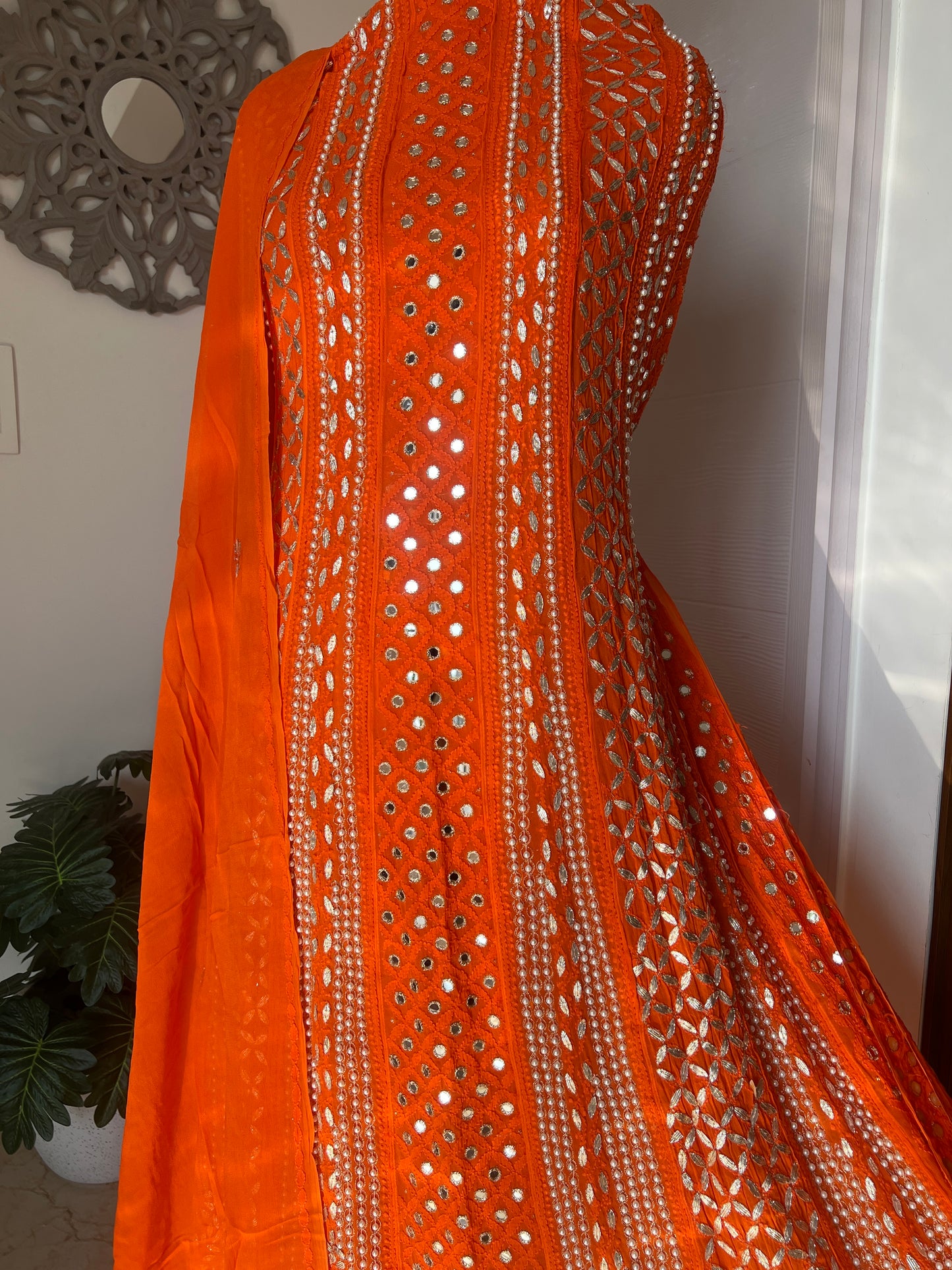 Orange Chikankari pearl mirror and Gota Anarkali