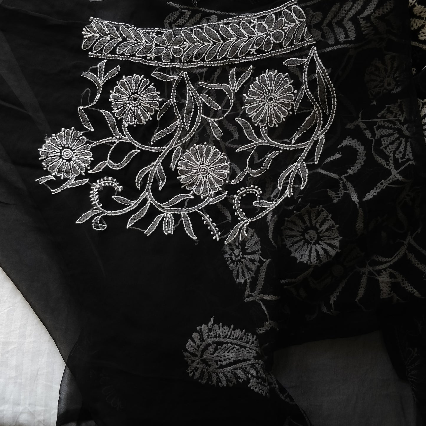 Black and White semi georgette allover fine Chikankari saree.