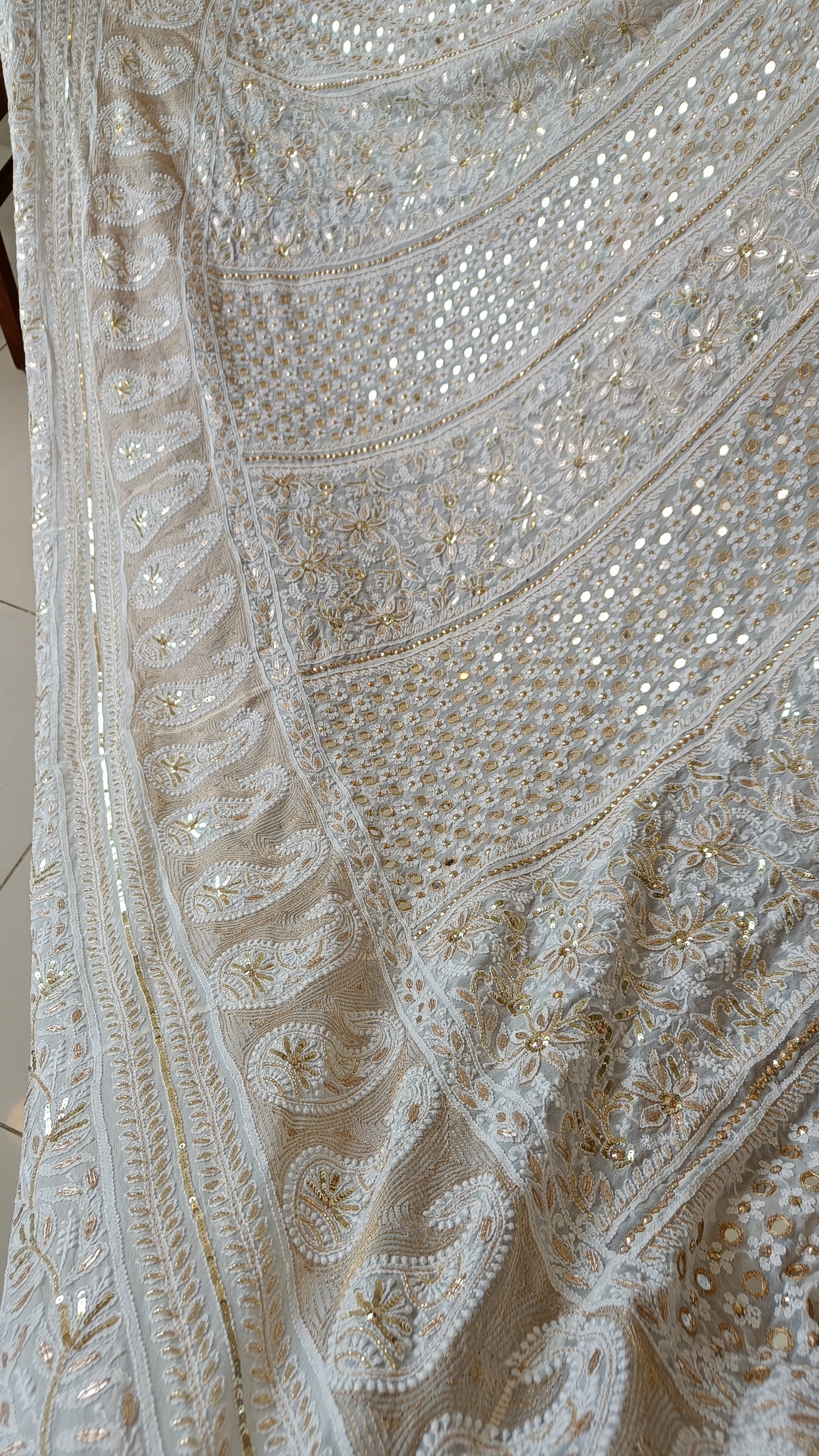 White designer lehenga skirt with allover Chikankari and heavy embellishments Lehenga skirt