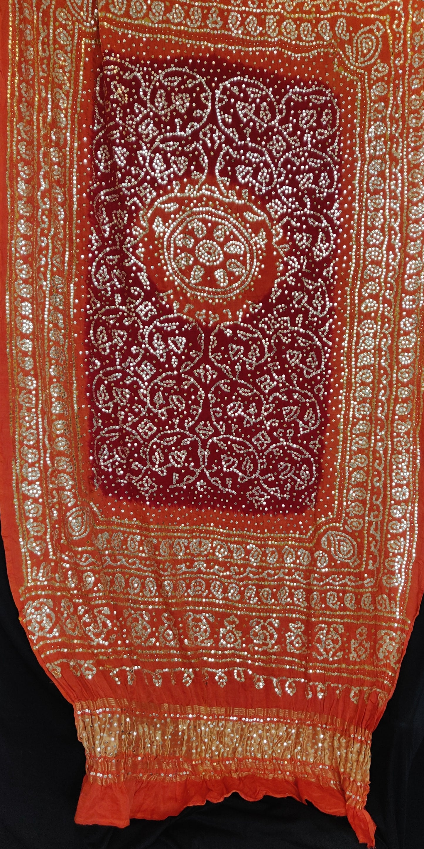 Orange and red gajji silk bandhej dupatta with very heavy mukaish work