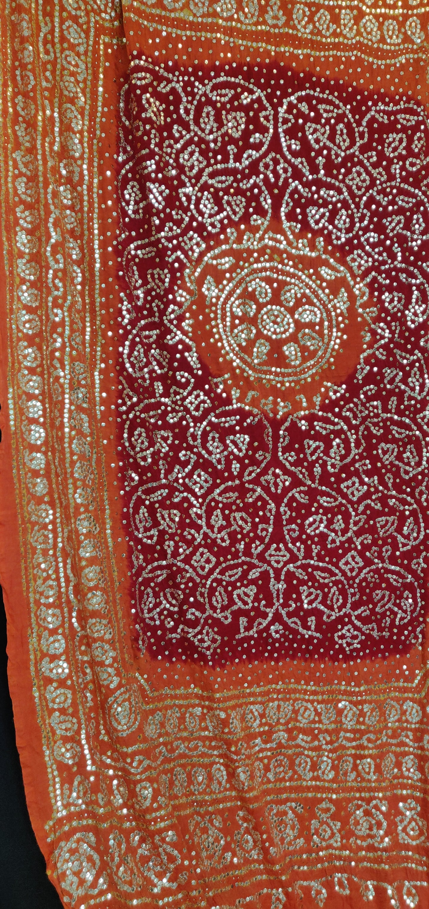 Orange and red gajji silk bandhej dupatta with very heavy mukaish work