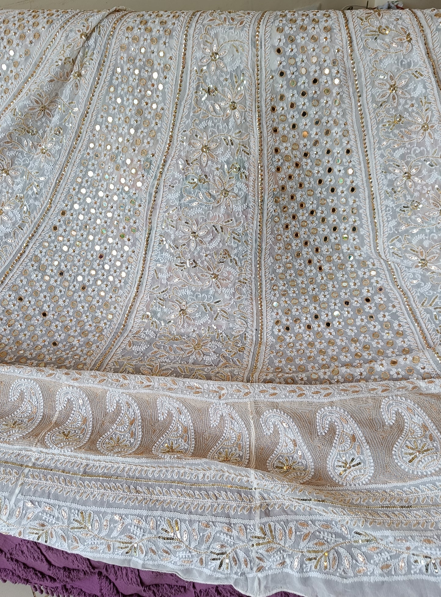 White designer lehenga skirt with allover Chikankari and heavy embellishments Lehenga skirt