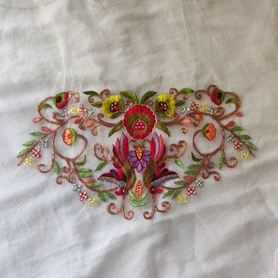 White net blouse with multicolored zari hand embroidery